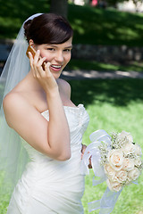 Image showing Happy Bride Using Cell Phone