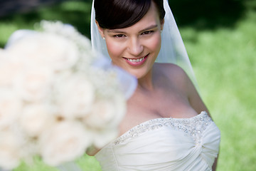 Image showing Bride Showing Off Her Flower Bouquet