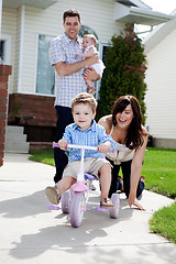 Image showing Cute Boy Riding Tricycle