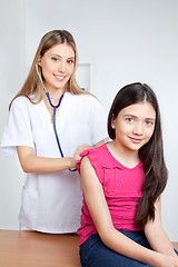 Image showing Doctor Examining Child in Clinic