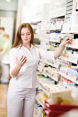 Image showing Pharmacist Looking at Prescription
