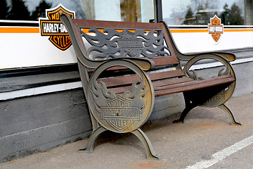 Image showing Vintage Bench with Harley-Davidson Motorcycles Signage