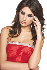 Image showing Pensive beautiful brunette woman in red dress