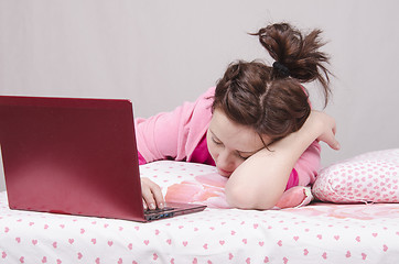 Image showing Girl in bed asleep for a laptop