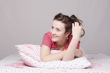 Image showing The young beautiful girl wants in bed