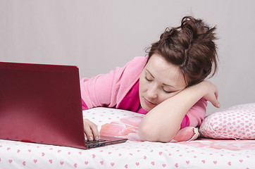 Image showing Girl in bed asleep for a laptop