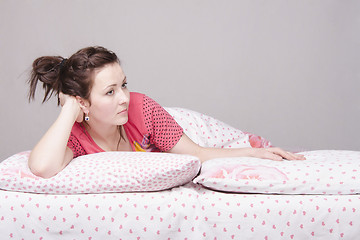 Image showing young girl is sad lying in bed