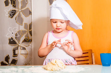 Image showing baby girl in cook role