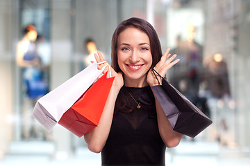 Image showing Shopping Girl with showcase background