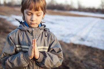 Image showing boy at prayer