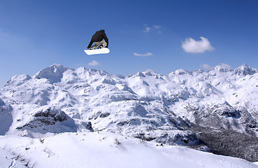 Image showing Snowboarder jumping