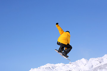 Image showing Snowboarder jumping