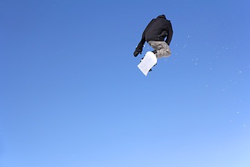 Image showing Snowboarder jumping