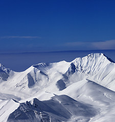 Image showing View on off-piste snowy slope at nice sunny day