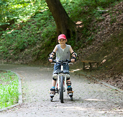 Image showing Skates and bike boy