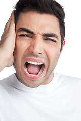 Image showing Young Asian Man Covering Ears