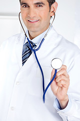 Image showing Male Doctor Holding Stethoscope