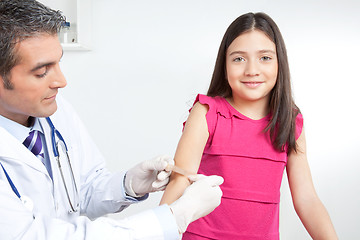 Image showing Doctor Applying Bandage on Hand