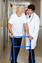 Image showing Doctor Assisting Old Man On a Walker