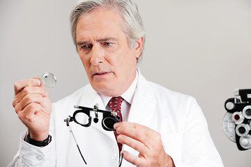 Image showing Optometrist Checking the Lens Of Trial Frame