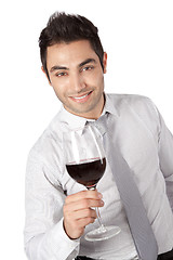 Image showing Businessman Holding Red Wine Glass