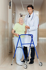 Image showing Doctor Assisting An Old Woman With Her Walker