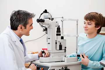 Image showing Boy Consulting Doctor After Visual Field Test