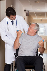 Image showing Doctor with Patient on Wheel Chair