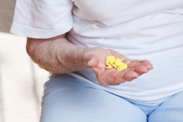 Image showing Sick Woman taking her Pills