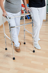 Image showing Woman With Walker And Trainer