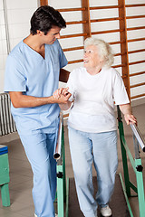 Image showing Woman On Walking Track Looking At Physical Therapist