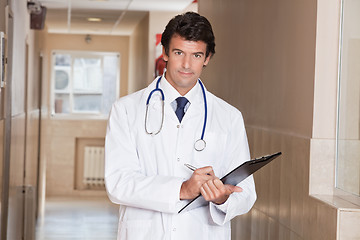 Image showing Male Doctor Standing with Folder