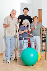 Image showing Disabled Senior People With Trainer Showing Thumbs Up Sign
