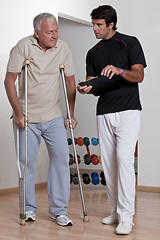 Image showing Patient on Crutches and Physician