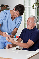 Image showing Doctor taking a Blood Sample