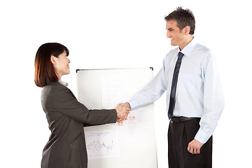 Image showing Businesswoman And Businessman Shaking Hand