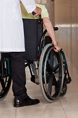 Image showing Doctor with Patient on Wheel Chair