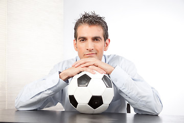 Image showing Businessman With Football At Work