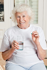 Image showing Woman Taking her Medicine