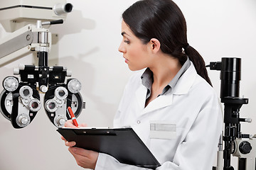 Image showing Eye Doctor Writing About Phoropter