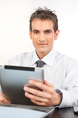 Image showing Businessman Holding Digital Tablet