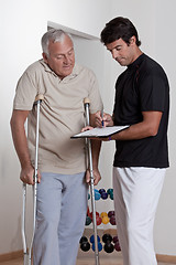 Image showing Patient on Crutches and Physician