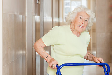 Image showing Happy Senior Woman Using Zimmer Frame