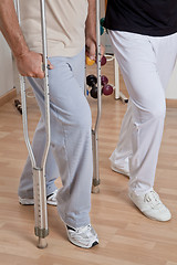 Image showing Patient on Crutches and Physician