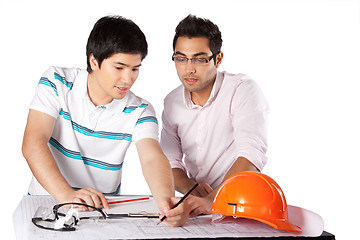 Image showing Two Architects Discussing on Blueprints