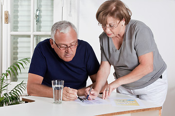 Image showing Mature Couple playing Scrabble Game