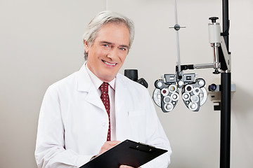 Image showing Smiling Optometrist With Notepad