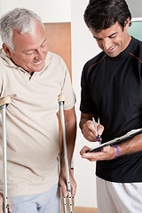 Image showing Patient on Crutches and Physician