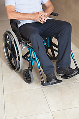 Image showing Low Section Of a Senior Man Sitting In a Wheelchair