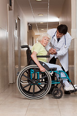 Image showing Doctor with Patient on Wheel Chair